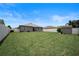 Large backyard with grassy lawn and shed at 5756 Lakeside Landings Blvd, Winter Haven, FL 33881
