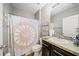 Bathroom with shower/tub combo and updated vanity at 5756 Lakeside Landings Blvd, Winter Haven, FL 33881
