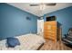 Bedroom with a double bed and blue wall at 5756 Lakeside Landings Blvd, Winter Haven, FL 33881