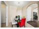 Bright dining area with glass table and four chairs at 5756 Lakeside Landings Blvd, Winter Haven, FL 33881