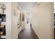 Long hallway with wood floors and a full-length mirror at 5756 Lakeside Landings Blvd, Winter Haven, FL 33881