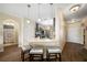 Kitchen with breakfast bar and view into living room at 5756 Lakeside Landings Blvd, Winter Haven, FL 33881