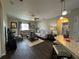 Inviting living room featuring stylish furnishings, neutral paint, wood-look floors and decorative lighting at 5756 Lakeside Landings Blvd, Winter Haven, FL 33881