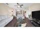 Open living space with two sofas and a view of the kitchen at 5756 Lakeside Landings Blvd, Winter Haven, FL 33881