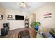 Home office or den with a TV and comfortable seating at 5756 Lakeside Landings Blvd, Winter Haven, FL 33881