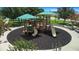 Community playground with playset and safety surface at 5756 Lakeside Landings Blvd, Winter Haven, FL 33881