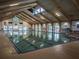 Indoor community pool with high ceilings at 610 Fannich Ct, Leesburg, FL 34788
