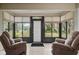 Bright sunroom with ample natural light and access to backyard at 610 Fannich Ct, Leesburg, FL 34788