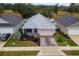 Single-story house with metal roof, screened porch, and landscaped yard at 6342 Sanders Grove Cir, Okahumpka, FL 34762