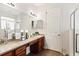 Double vanity bathroom with a large walk-in shower at 6342 Sanders Grove Cir, Okahumpka, FL 34762