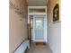 Inviting front entry with a bench and welcome mat at 6342 Sanders Grove Cir, Okahumpka, FL 34762