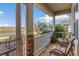Screened porch with seating area, perfect for relaxing outdoors at 6342 Sanders Grove Cir, Okahumpka, FL 34762