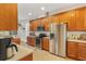 Well-equipped kitchen with stainless steel appliances at 6342 Sanders Grove Cir, Okahumpka, FL 34762