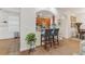 Kitchen breakfast bar with two gray barstools at 6342 Sanders Grove Cir, Okahumpka, FL 34762