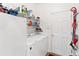 Laundry room with washer, dryer, and extra storage at 6342 Sanders Grove Cir, Okahumpka, FL 34762
