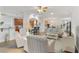 Bright living room, open to kitchen and dining areas at 6342 Sanders Grove Cir, Okahumpka, FL 34762