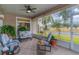 Peaceful screened porch overlooking the backyard at 6342 Sanders Grove Cir, Okahumpka, FL 34762
