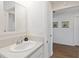 Simple bathroom with sink and mirror at 6764 Mary Loop, The Villages, FL 34762