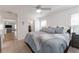 Main bedroom with king bed and en-suite bathroom access at 6764 Mary Loop, The Villages, FL 34762