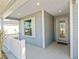 Front entrance with glass door and white railing at 6764 Mary Loop, The Villages, FL 34762