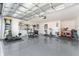Garage converted into a home gym with equipment at 6764 Mary Loop, The Villages, FL 34762
