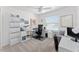 Home office with desk, chair, and built-in shelving at 6764 Mary Loop, The Villages, FL 34762