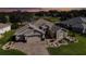 One-story home with landscaped yard and paver driveway, offering a serene view of the surrounding golf course at 9059 Se 177Th Grassmere St, The Villages, FL 32162