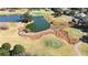 Golf course community with pond and landscaping at 9059 Se 177Th Grassmere St, The Villages, FL 32162
