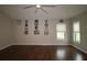 Bright bedroom featuring hardwood floors and ample natural light at 9059 Se 177Th Grassmere St, The Villages, FL 32162