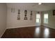 Bright bedroom featuring hardwood floors and ample natural light at 9059 Se 177Th Grassmere St, The Villages, FL 32162