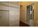 Large walk-in closet with built-in shelves and drawers at 9059 Se 177Th Grassmere St, The Villages, FL 32162