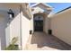 Elegant entryway with a paver walkway and black door at 9059 Se 177Th Grassmere St, The Villages, FL 32162