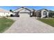 Beautiful home with three-car garage and paver driveway at 9059 Se 177Th Grassmere St, The Villages, FL 32162