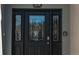 Eye-catching black front door with beveled glass at 9059 Se 177Th Grassmere St, The Villages, FL 32162