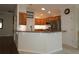 Kitchen features granite countertops, stainless steel appliances, and an island at 9059 Se 177Th Grassmere St, The Villages, FL 32162