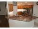 Modern kitchen with granite countertops and stainless steel appliances at 9059 Se 177Th Grassmere St, The Villages, FL 32162