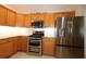 Kitchen with stainless steel appliances and granite countertops at 9059 Se 177Th Grassmere St, The Villages, FL 32162