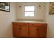 Laundry room with wood cabinets and countertop at 9059 Se 177Th Grassmere St, The Villages, FL 32162