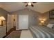 Main bedroom with king-size bed, walk-in closet and sitting area at 9059 Se 177Th Grassmere St, The Villages, FL 32162