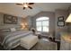 Main bedroom with king-size bed, sitting area, and vaulted ceiling at 9059 Se 177Th Grassmere St, The Villages, FL 32162