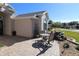 Relaxing patio with seating area, landscaping, and water feature at 9059 Se 177Th Grassmere St, The Villages, FL 32162