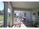 Sunroom with sliding glass doors opening to a backyard patio at 9059 Se 177Th Grassmere St, The Villages, FL 32162