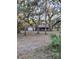 Small house and detached garage under large oak trees at 10094 Sw 153Rd Ln, Dunnellon, FL 34432