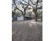 House with detached garage, surrounded by mature trees at 10094 Sw 153Rd Ln, Dunnellon, FL 34432