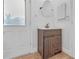 Charming bathroom with brown vanity and tiled floor at 10406 Lakeshore Dr, Clermont, FL 34711