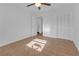 Spacious bedroom with tile floors and mirrored closet doors at 10406 Lakeshore Dr, Clermont, FL 34711