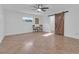 Bright bedroom with tile flooring and ceiling fan at 10406 Lakeshore Dr, Clermont, FL 34711