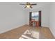 Well-lit bedroom featuring a desk and chair at 10406 Lakeshore Dr, Clermont, FL 34711