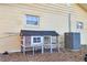 Wooden chicken coop and AC unit in backyard at 10406 Lakeshore Dr, Clermont, FL 34711