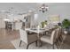 Bright dining room with chandelier and seating for six at 10406 Lakeshore Dr, Clermont, FL 34711